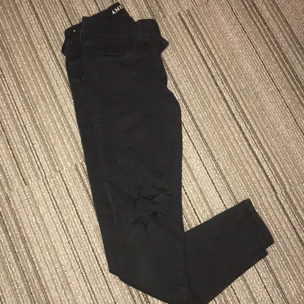 Skinny black distressed jeans